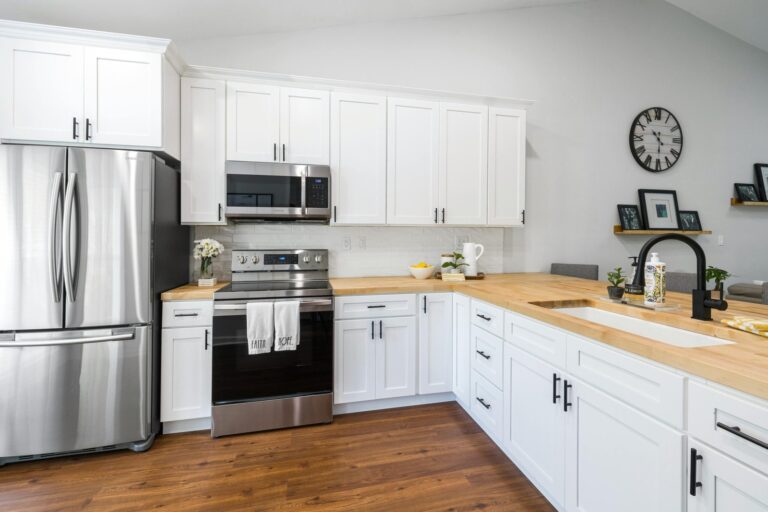 Greenpoint, Brooklyn. Beautiful kitchen with white cabinets and spotless hardwood floors